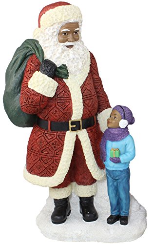 African American Santa Claus Standing with Boy